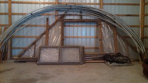 By the end of March, I had already found a greenhouse frame for sale. Breck, Dad and I went to pick it up. I can't wait to get it up at our new place. At the same time, Scott was working on framing in our pole barn. 